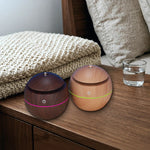 Two mushroom humidifiers misting with LED glow